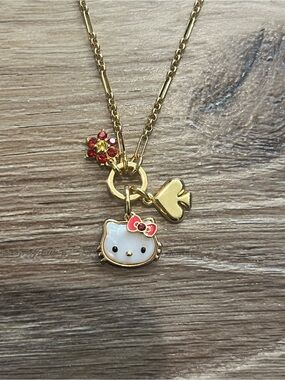 Kate Spade Hello Kitty Gold Tone Necklace with White Enamel Face and Red Bow